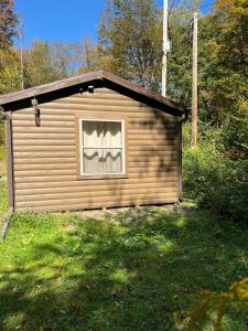 Pennsylvania Glamping Destination for Nature Getaways for Four in Charming Log Cabin