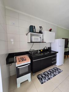 Apê com varanda gourmet em Maranduba!