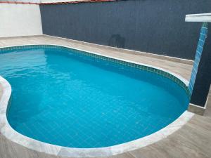 Sobrado na Praia com Piscina em Condomínio