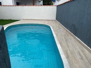 Sobrado na Praia com Piscina em Condomínio