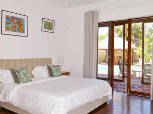 Villa Family Premium - 4min Plage Pereybère - Parking gratuit - Piscine - Jardin tropical - Ménage 3x par semaine - Intimité totale - Expérience chic et authentique