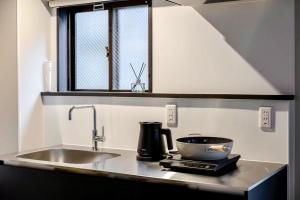 AURA YUZAWA Apartment Hotel - 1Bedroom Apartment with Living Dining Kitchen Sleeps 2 to 4, Bedroom with 2-Double Bed, Living Room with 1-Sofa Bed