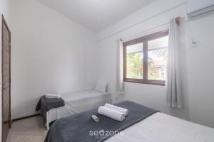 Aptos completos em cond. com piscina a 500m da Praia de Taperapuã - ENLs