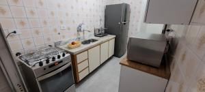 Apartamento na Enseada ambiente familiar e confortável