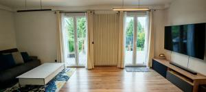 Maison chaleureuse avec jardin et piscine, Coubron