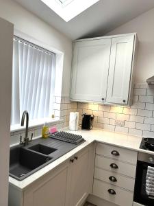 Brain Properties Limited - Garden flat with Parking near QA Hospital