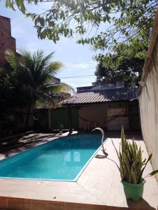 Casa de Verão, 04 quartos, 03 banheiros, piscina e churrasqueira para relaxar