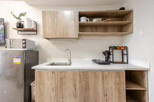 Modern Minimalist Studio with Balcony & Sunset View