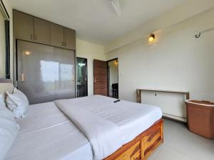 Dreamy Candolim Esacpe - 2BHK with River View & Pool - Premium Stay Experience