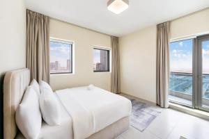 FAM Living - 2BR Apartment with Burj & Canal Views at The Bay