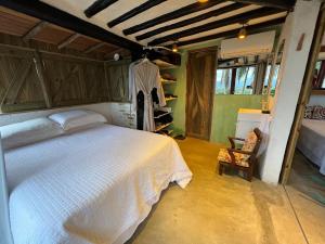 Suíte e sala - Vista Barra do Sahy