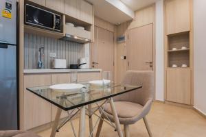 Olympus city garden direct pool access apartment by Sankalp