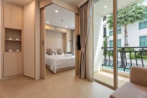 Olympus city garden direct pool access apartment by Sankalp