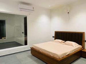 A peaceful 2bhk farmhouse with open space for parties