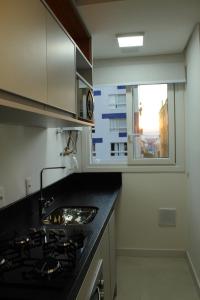 Apto 2 suítes lavabo próximo santinha