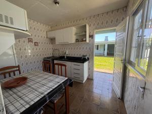 Casa Xangri-Lá no centro divisa com Atlântida