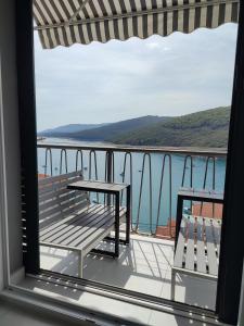 Apartment Noemi with a direct beach view