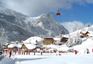 Mountain house with two barns and a garden