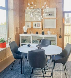 Wooden Home Among Apple Trees With Ocean View
