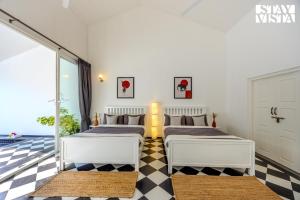 StayVista at Mudra Tattva - Pvt Pool,Lawn,Jacuzzi 2BR Luxury Rooms