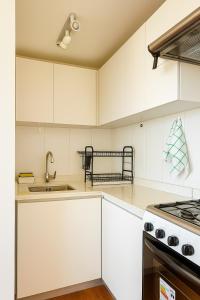 Modern apartment steps from Parque Arauco mall