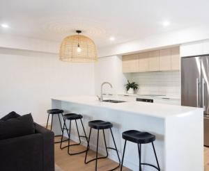 Stylish Sun Soaked Duplex Walk to Beach