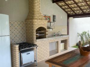 Casa com 4 suítes perto da praia