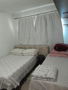 Quarto na praia banheiro compartilhado