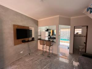 Casa praia de condomínio com piscina e churrasqueira