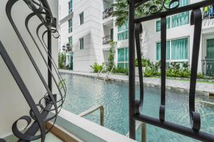 Olympus city garden direct pool access apartment by Sankalp