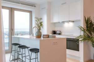 Modern Beach Apartment with Balcony & Parking