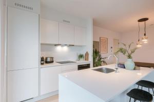 Modern Beach Apartment with Balcony & Parking