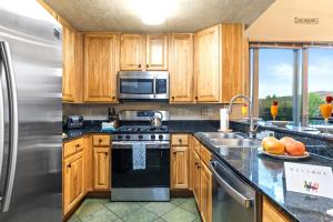KBM Resorts Crestview Condos Spacious condo near Olympic Park with gas fireplace year-round pool hot tub city wide shuttle access. CVC-308B