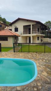 Single-story house with pool and barbecue area