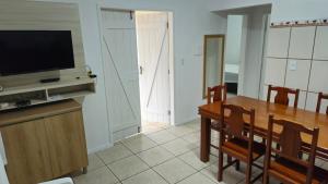 Single-story house with pool and barbecue area