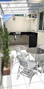 Frente ao Mar Guarapari Enseada Azul - Área Garden Churrasqueira Privativa, Ar condicionado e 02 vagas de garagem