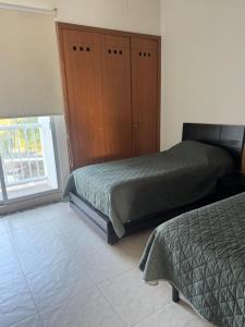 Depa en Acapulco Diamante - Albercas, Canchas y Jardines Apartment in Acapulco Diamante - Pools, Sports Courts and Garden Views