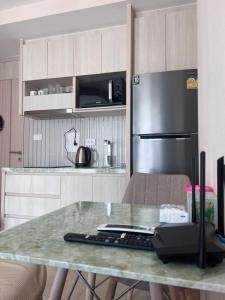 City Garden Olympus condo with balcony