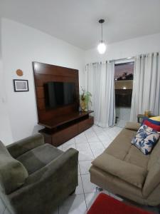 Lindo apartamento em frente à praia com piscina