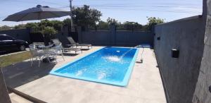 Casa com piscina na praia