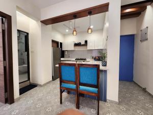 Central Candolim 1BHK Apartment Bright Living, TV & Kitchenette