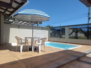 DISPONIVEL CARNAVAL, Casa com piscina, Ar condicionado, Pertinho Do Mar Em Capão Da Canoa