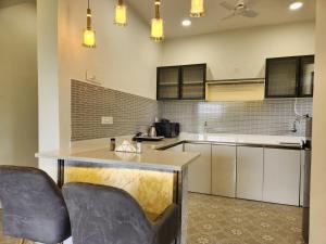 Luxury 2BHK Nature Retreat in Candolim with Pool Access, Nature Views & Fully Equipped Kitchen