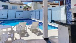 Casa Duplex 2 quartos com ar condicionado, sala, cozinha completa e internet privativa, a 80m metros da Praia de Taperapuã. Residencial Vila dos Diamantes, condomínio com piscina, 1 vaga de garagem e área gourmet