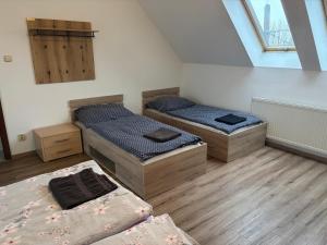 Podkrovní apartmán se společným bazénem