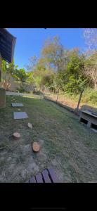 CASA NO CENTRO DE BOMBINHAS COM PISCINA E QUINTAL PRIVATIVO com vista para mata