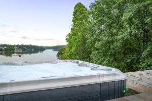 Secluded 3 Acre 5 BR Resort with Heated Private Lakeview Saltwater Infinity Pool, Hot Tub, Boat House, Sauna, and Game Room