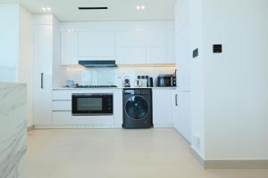 High-End 2BR JVC Retreat with Private Balcony Pool