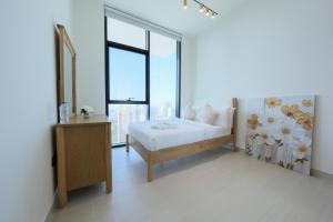 High-End 2BR JVC Retreat with Private Balcony Pool