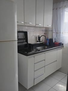 Pé na areia, praia Ocian